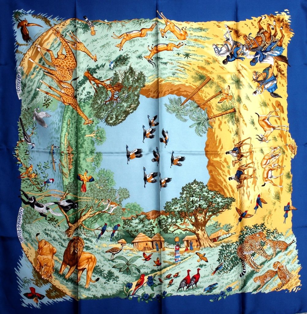 Vintage Hermès scarf in blue with African animal center and blue border.