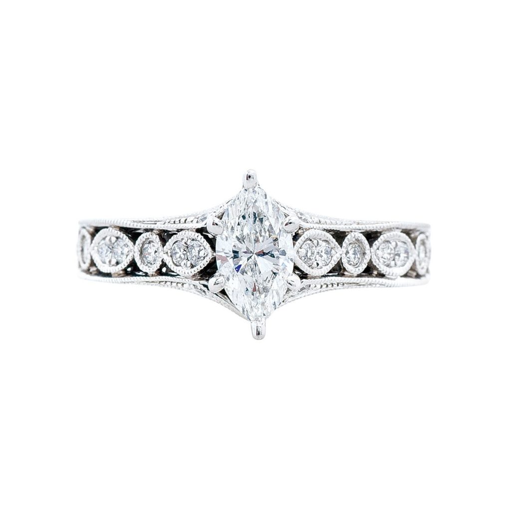 White gold diamond engagement ring with diamonds in the band.