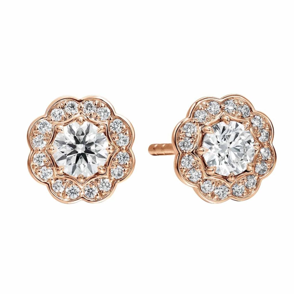 Rose gold flower stud earrings set with diamonds.