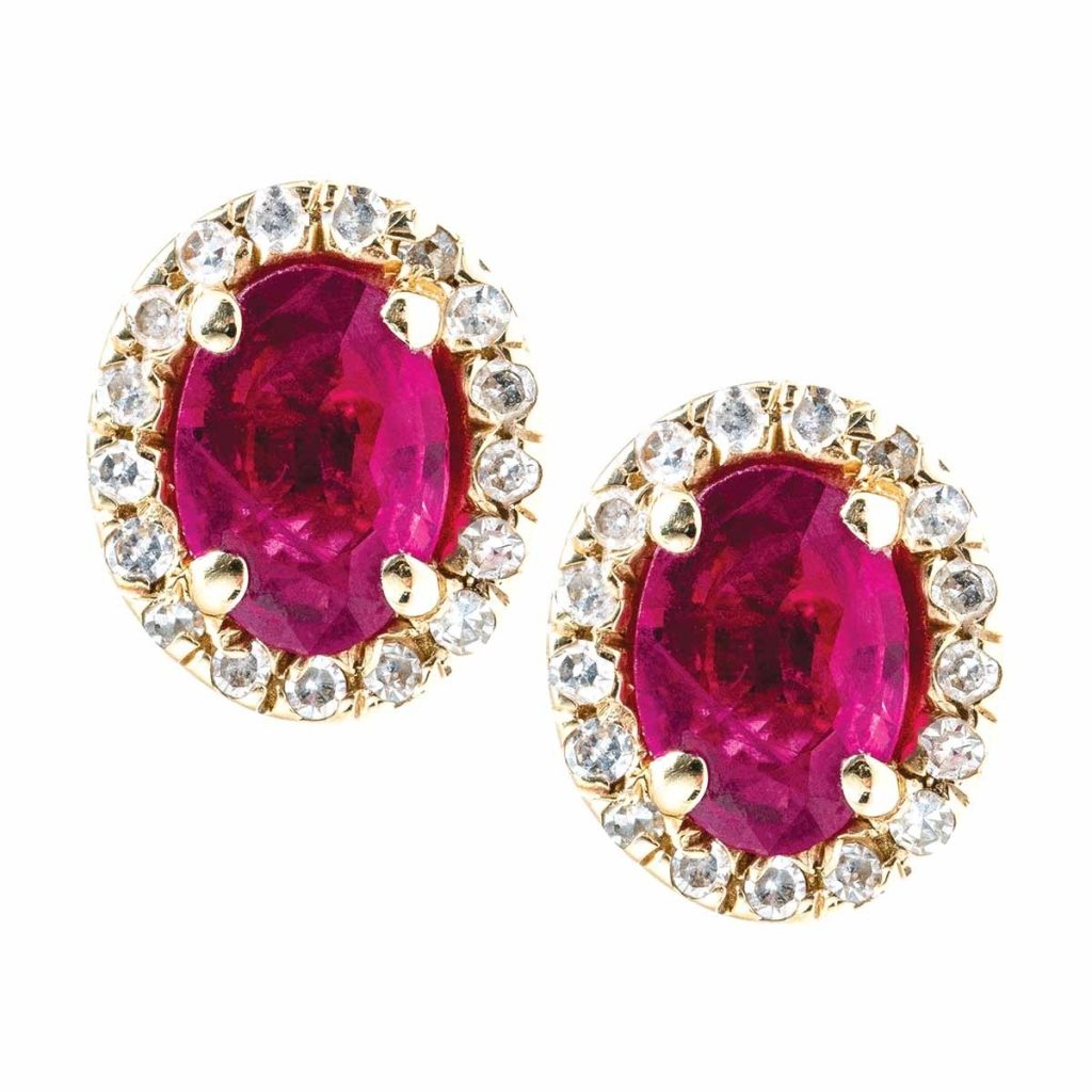 Yellow gold stud earrings set with rubies and diamond haloes.