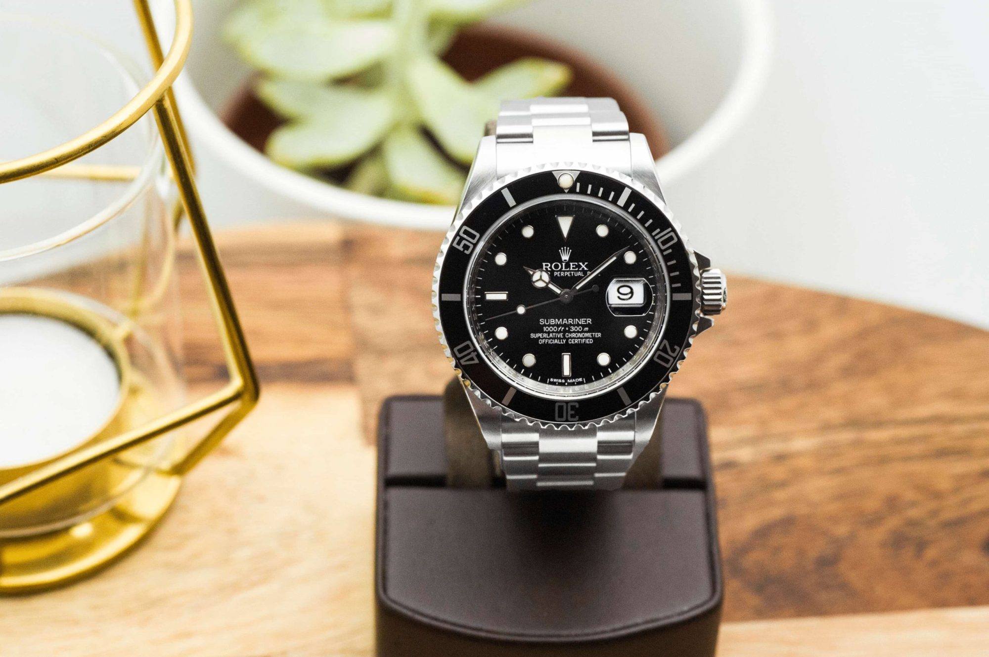 Pre-owned men’s Rolex Submariner in stainless steel with a black dial.