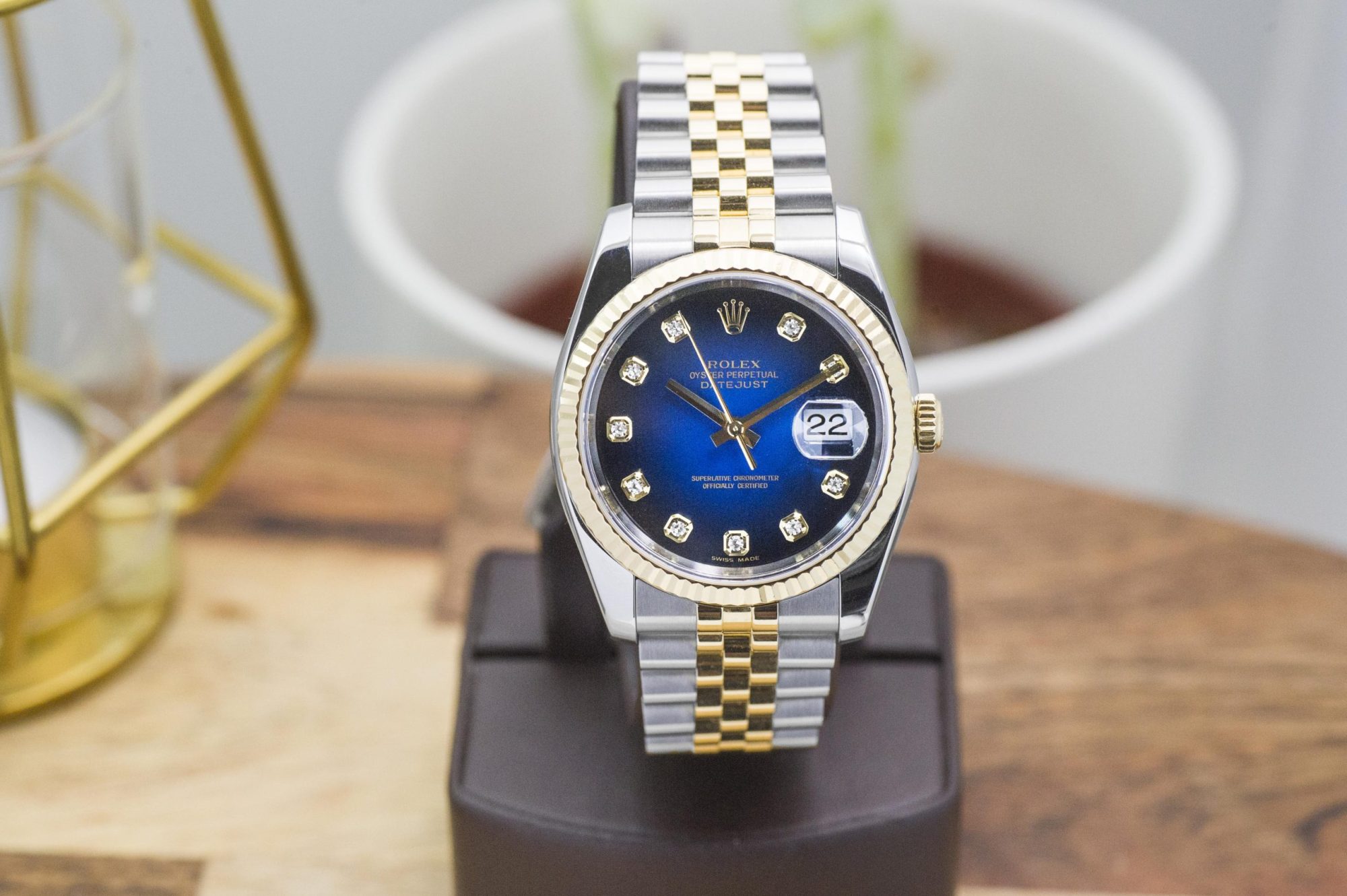 Pre-owned men’s Rolex Datejust in stainless steel and yellow gold with a blue diamond dial.