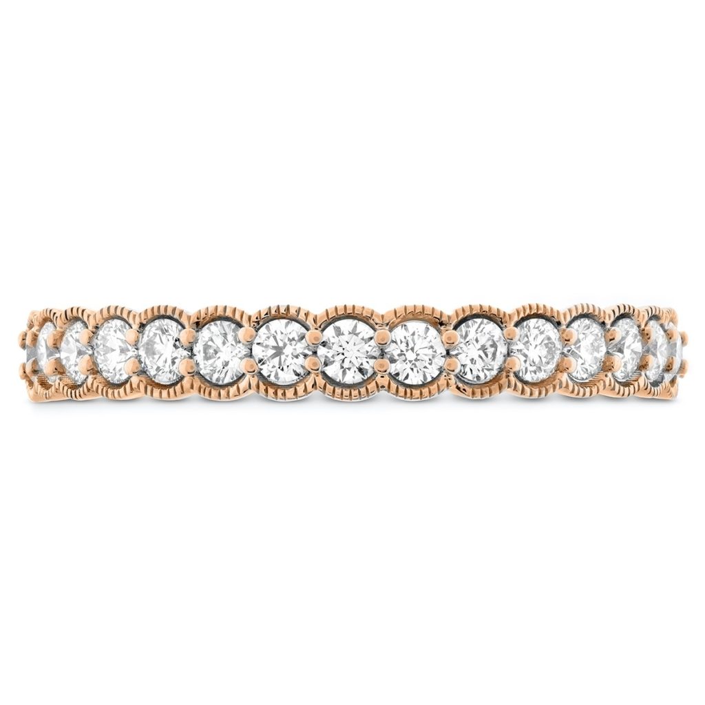 Yellow gold eternity band set with diamonds.