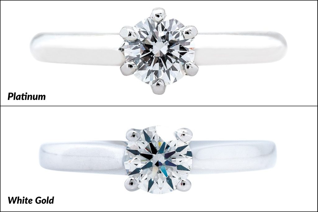 Two solitaire diamond engagement rings, one in white gold and one platinum, labelled to
show the difference in metals.