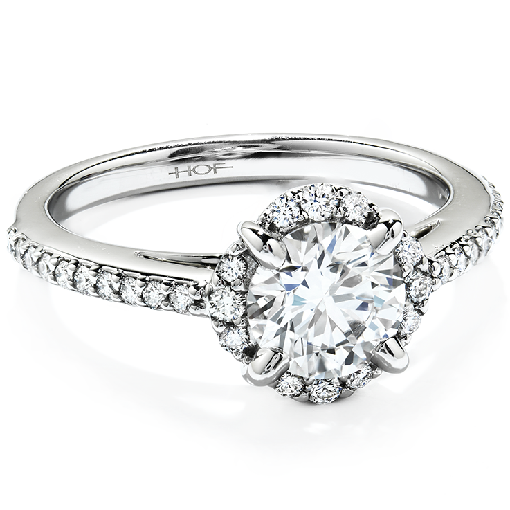 White gold diamond engagement ring with diamond halo and diamonds in the band.