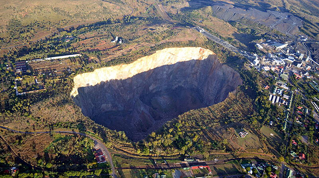 Aerial view of open pit diamond mine.