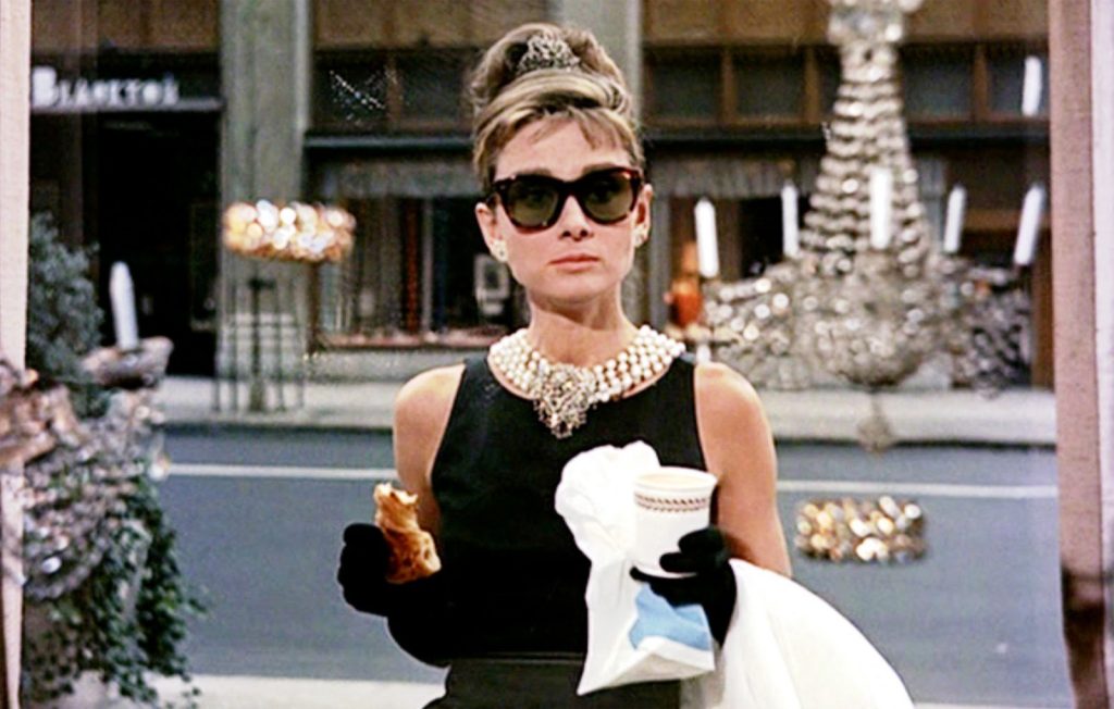 Still from Breakfast at Tiffany’s featuring Holly wearing vintage Tiffany & Co.accessories.