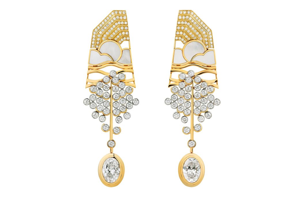 Yellow gold chandelier earrings set with diamonds.