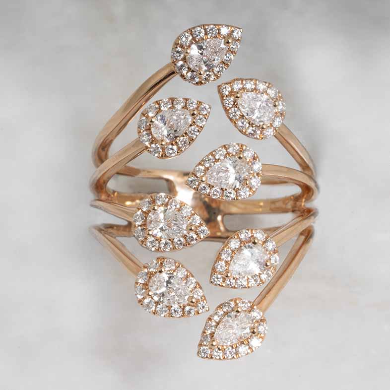 Rose gold open eight-row ring set with diamonds.