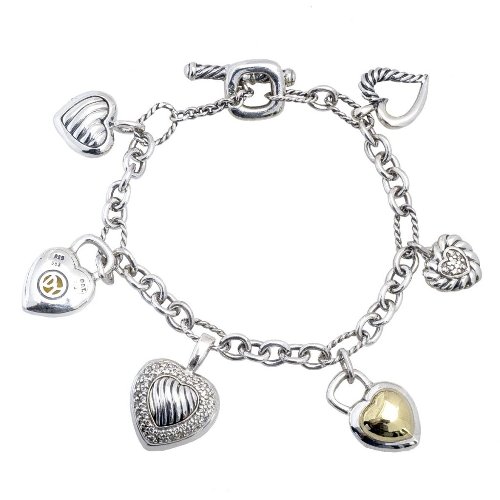 White gold heart charm bracelet set with citrine and diamonds.