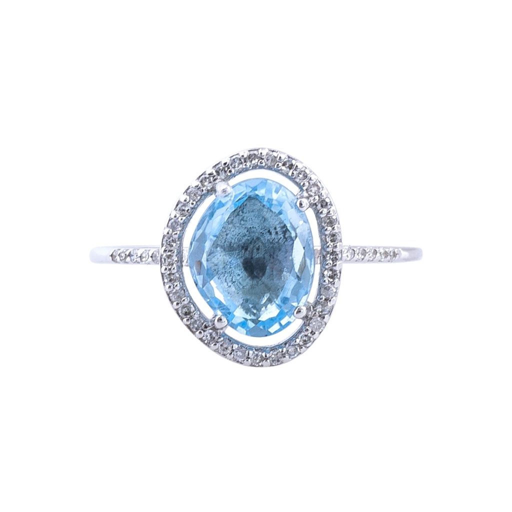 White gold freeform blue topaz and diamond ring.