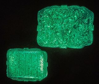 The Moghul Emerald from Ancient India shown on a black background.