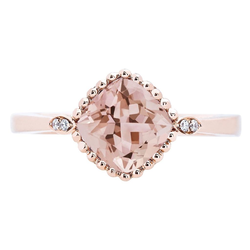 Rose gold morganite engagement ring with a diamond halo.