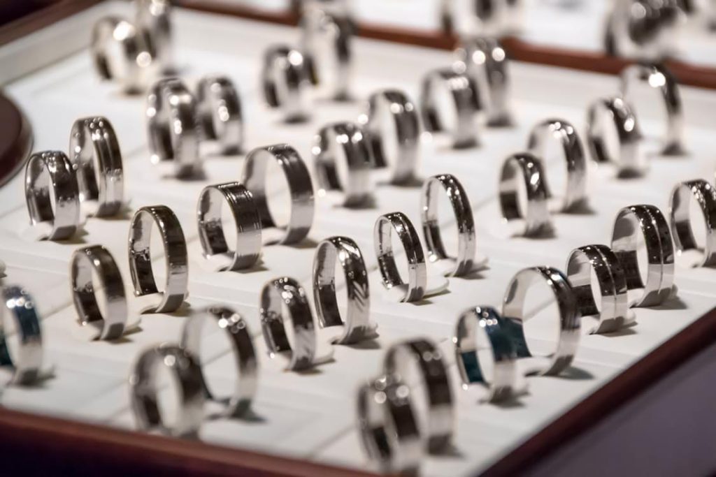 A showcase of elegant wedding rings displayed in a jewelry store, highlighting their intricate designs and craftsmanship.