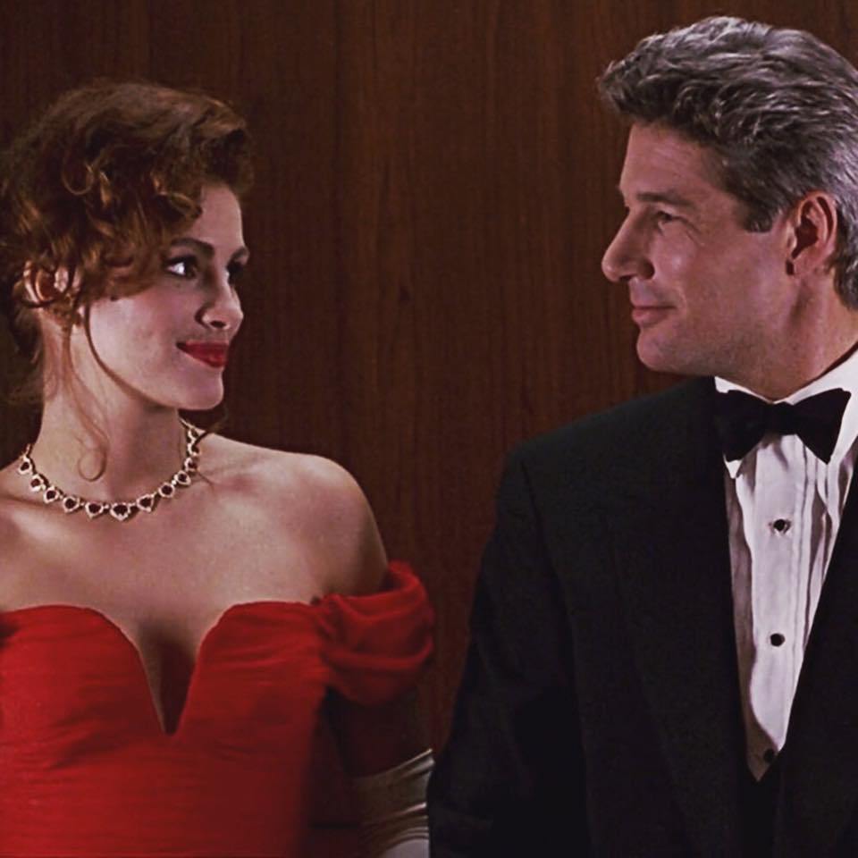 Still from Pretty Woman featuring Julia Roberts wearing a sparkling diamond and rubynecklace.