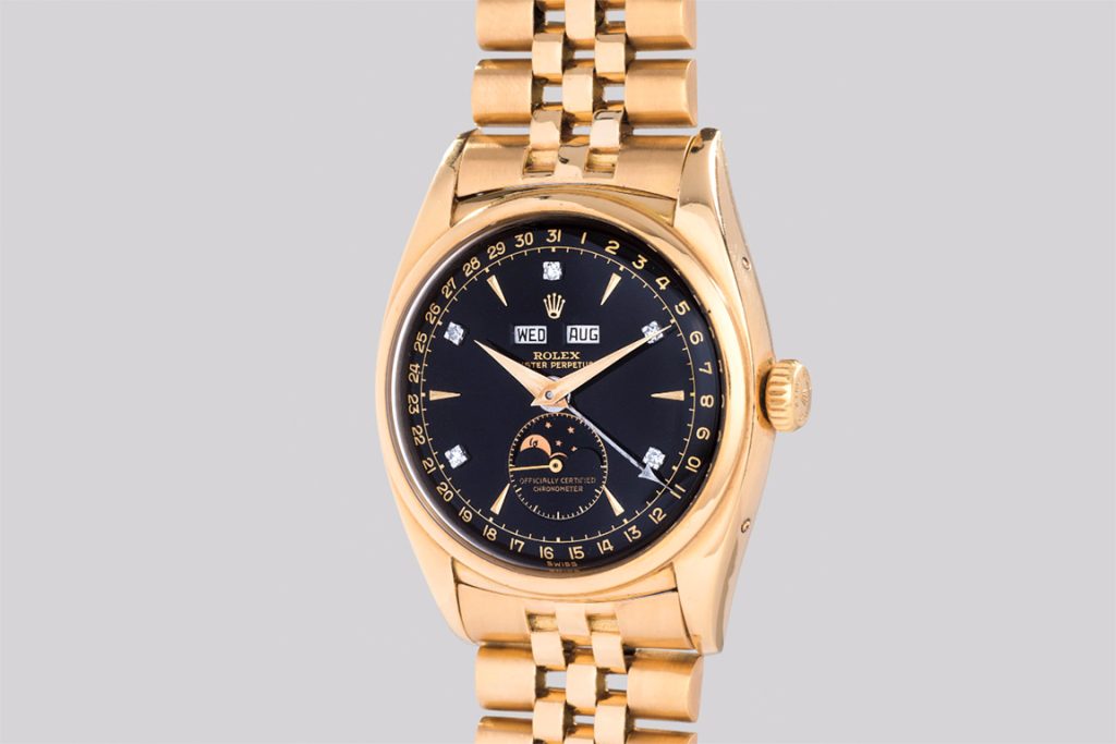 Pre-owned Rolex Bao Dai in yellow gold with black diamond dial.