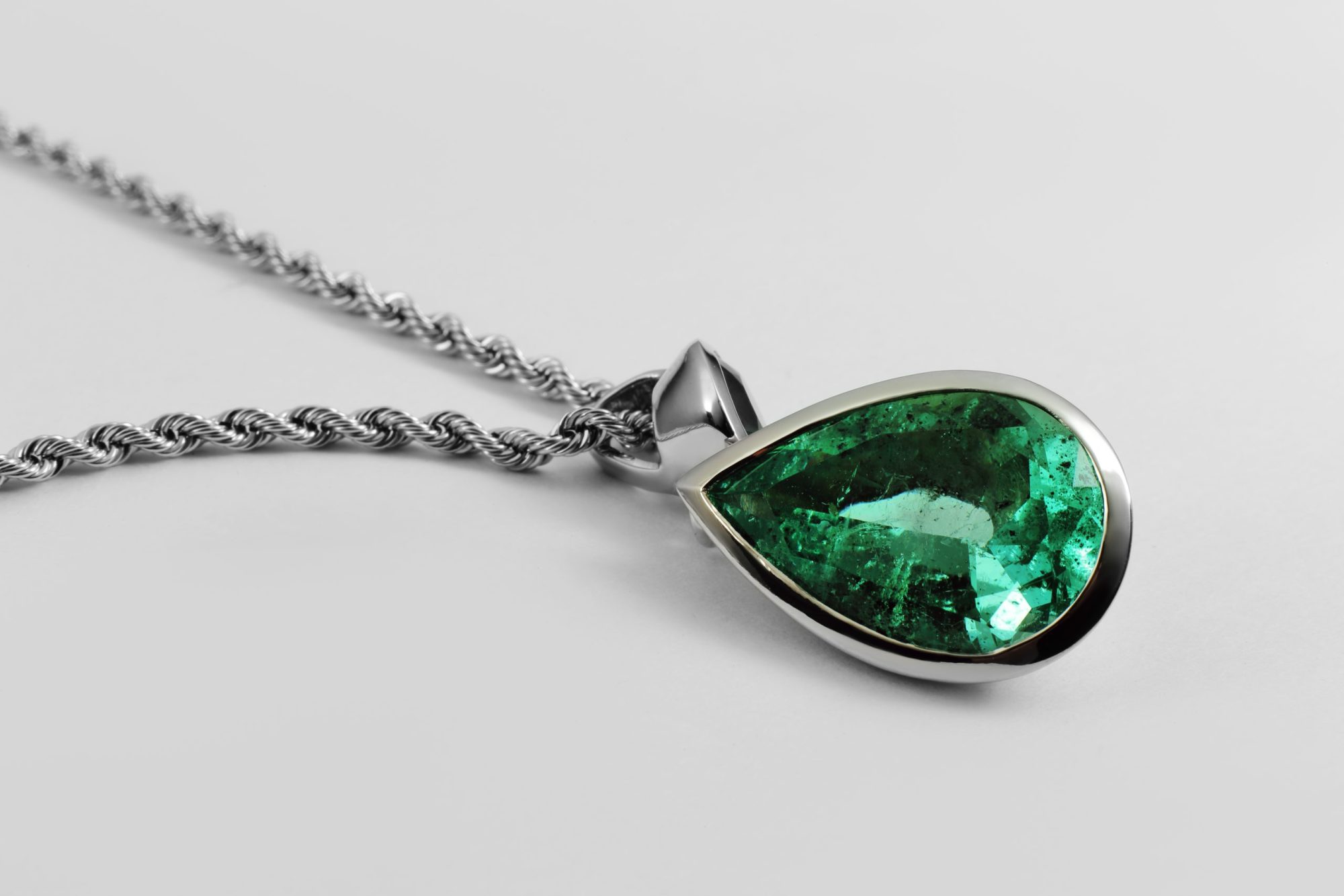 emerald pendant on a white gold chain