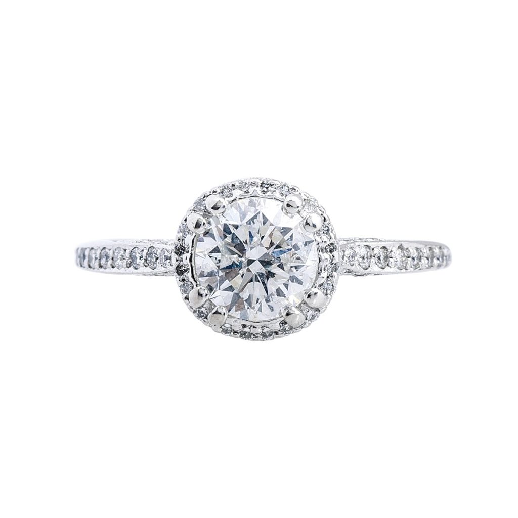 A stunning diamond halo engagement ring featuring a central diamond surrounded by a sparkling halo of smaller diamonds.