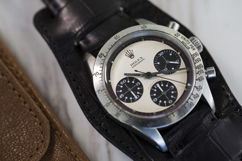 Pre-owned Rolex 1968 Paul Newman Cosmograph Daytona in stainless steel with a
black leather strap.