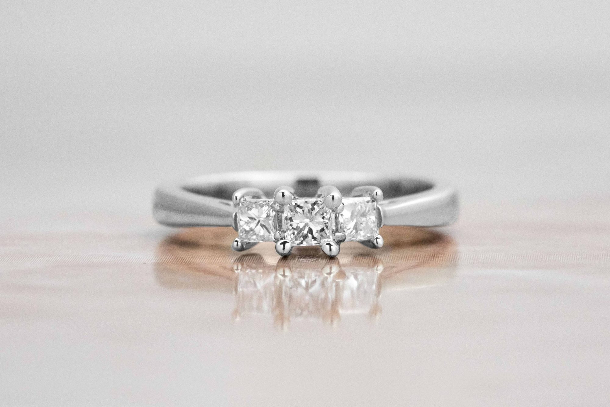 dainty three stone ring