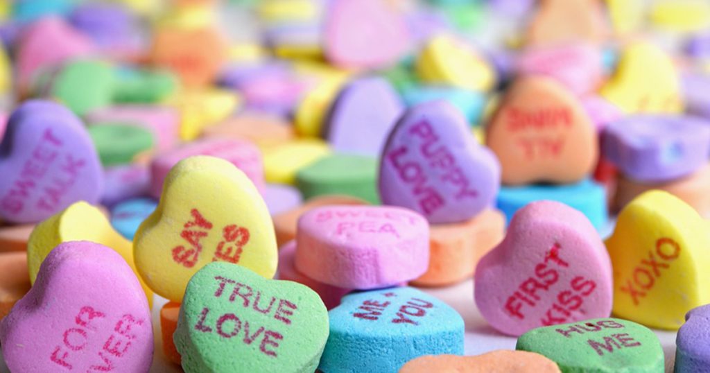 Pile of conversation heart candies.