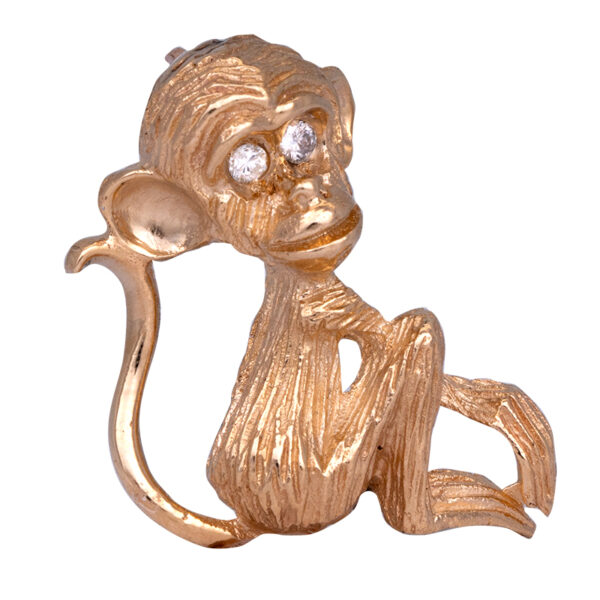 Gold monkey brooch with white diamond eyes