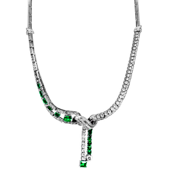 fancy emerald and diamond necklace with a knot and dangle feature