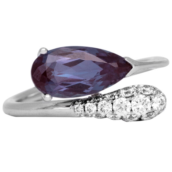 white gold bypass ring with a lab-grown pear alexandrite and diamonds in the band